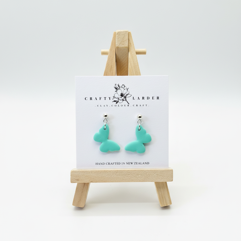 "Aqua blue butterfly dangle earrings on Crafty Larder card"