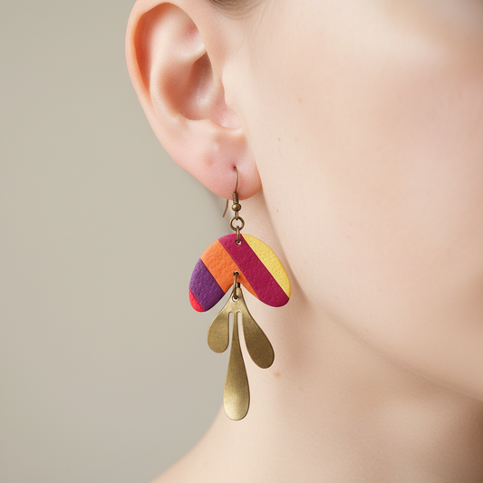 "Handmade polymer clay diagonal stripe arch dangle earrings with purple orange red yellow stripes and gold teardrop charms"