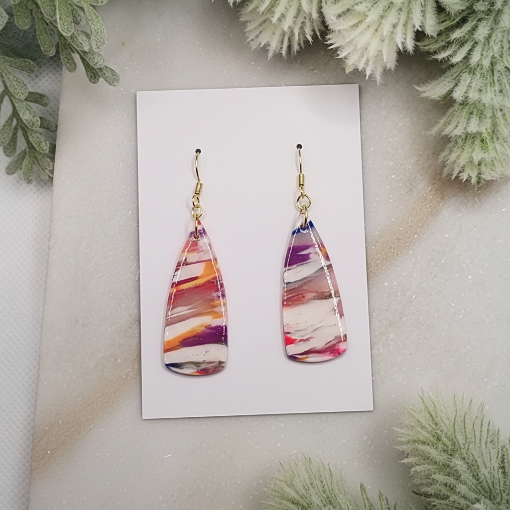 "Handmade polymer clay marble paddle drop earrings with pink coral purple orange striped pattern and gold hooks"