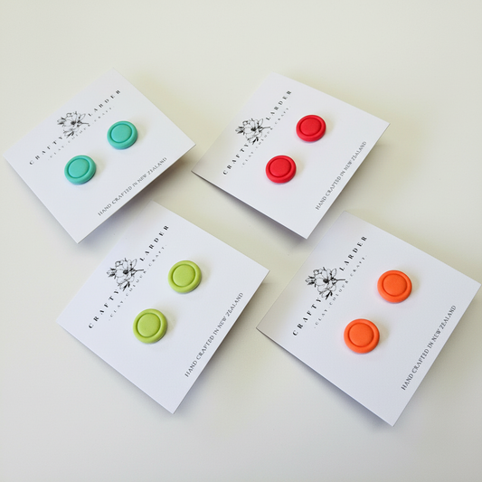 "Kids round button stud earrings in four colors - aqua, raspberry, lime green and orange"
