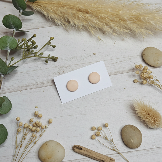 "Handmade polymer clay almond stud earrings in natural beige matte finish"
