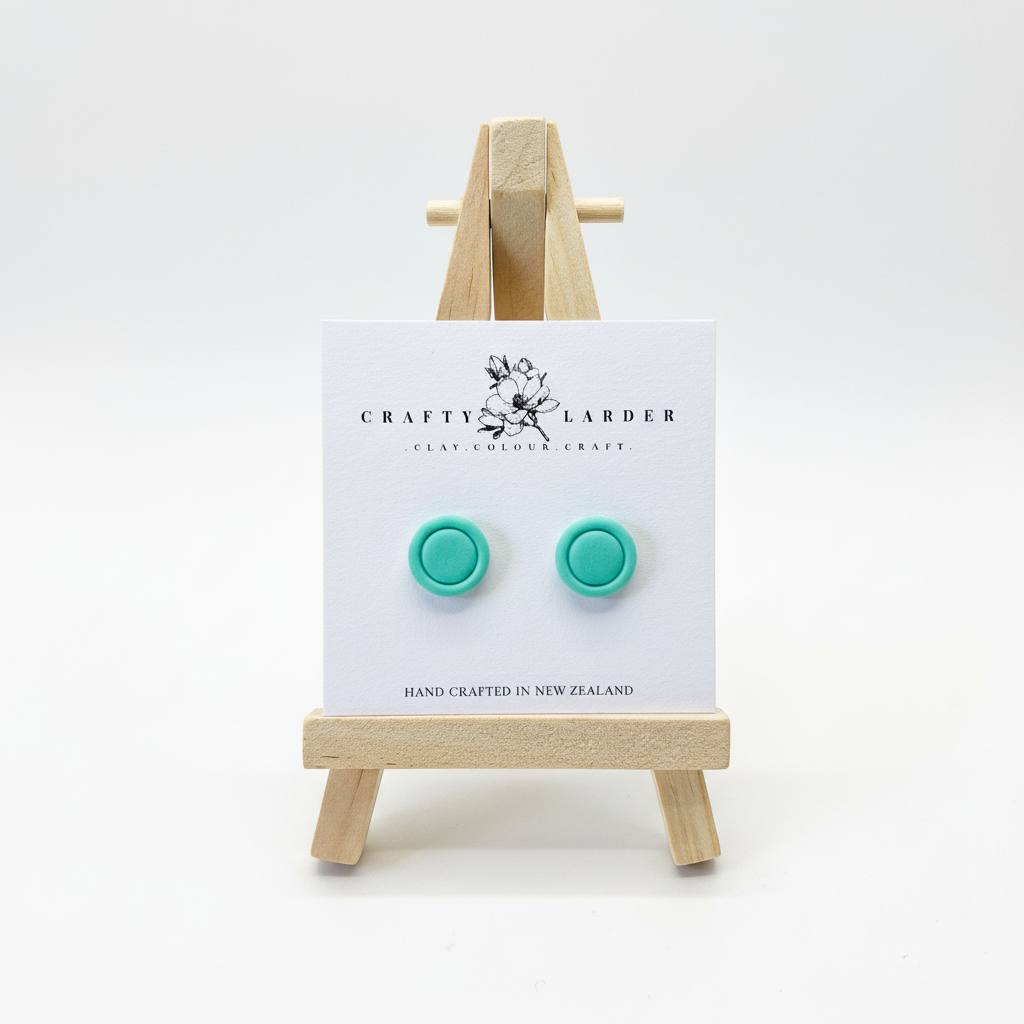 "Aqua blue round button stud earrings on Crafty Larder card"