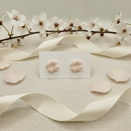 Briar Studs in Primrose Pink — handmade polymer clay 5-petal flower stud earrings with etched petal detail, displayed on white card with delicate cherry blossom and rose petal styling, handcrafted in New Zealand by Crafty Larder