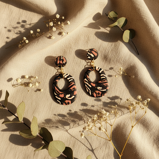 Handmade polymer clay statement earrings with leopard print cutout design on natural linen - Crafty Larder jewelry
