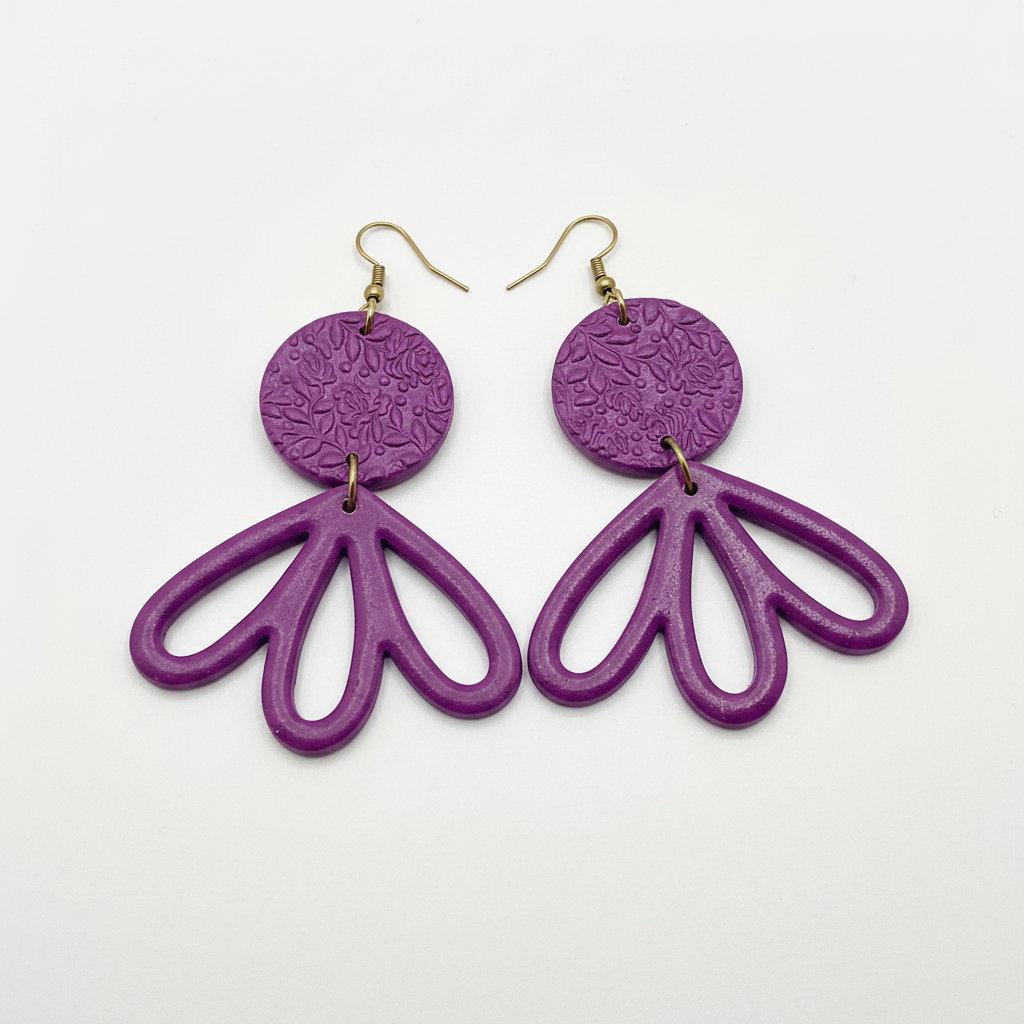 Large handmade purple polymer clay fan petal drop earrings with textured disc top, flat lay, by Crafty Larder NZ