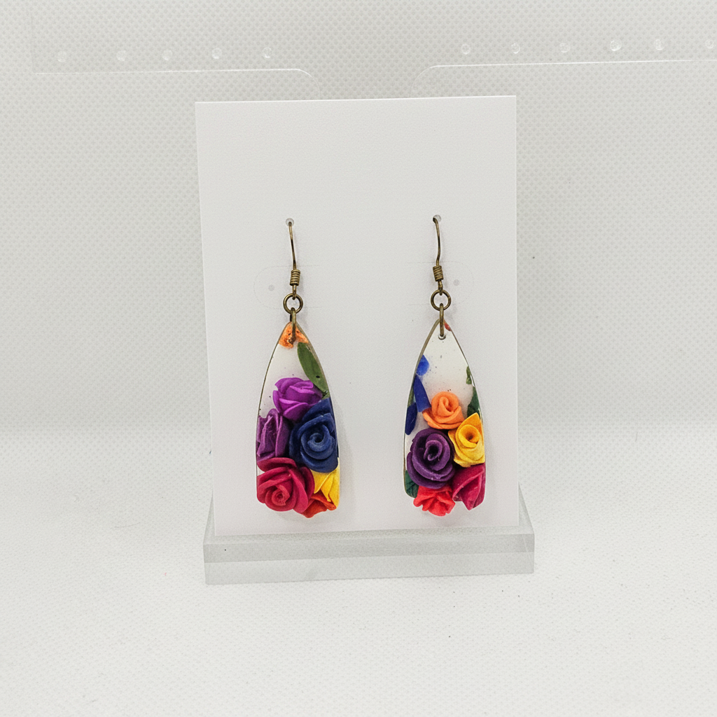 Handmade polymer clay teardrop drop earrings with 3D sculpted roses on plain white card, by Crafty Larder NZ
