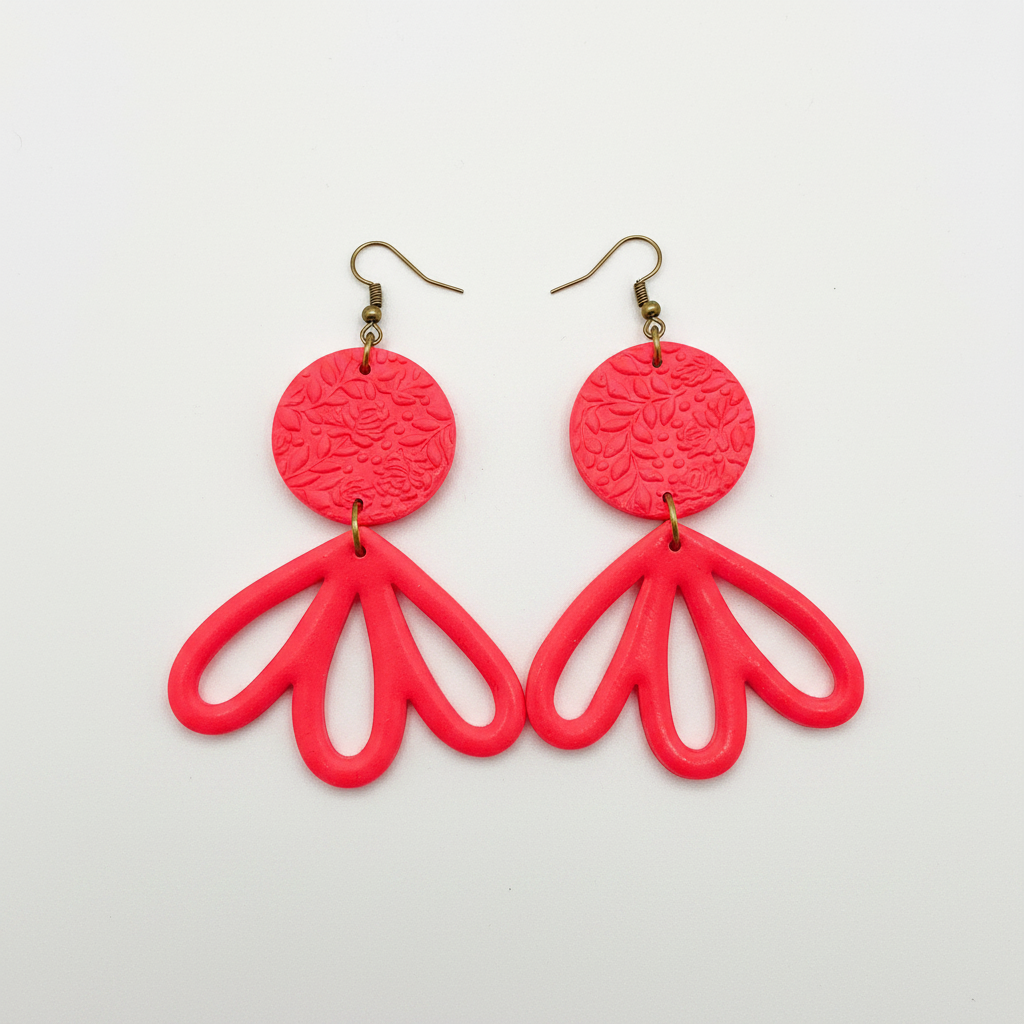 Large handmade coral polymer clay fan petal drop earrings with textured disc top, flat lay, by Crafty Larder NZ