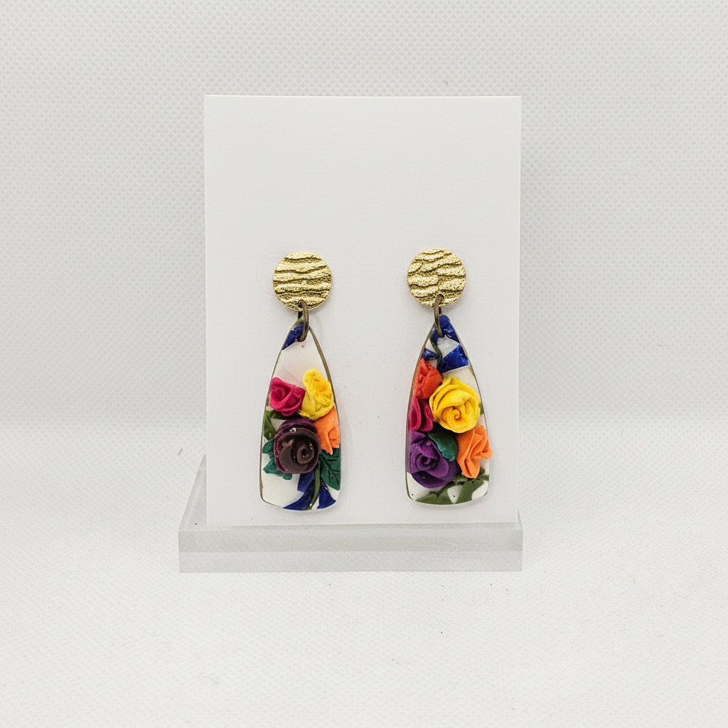 Handmade polymer clay paddle drop earrings with 3D sculpted roses and gold stud tops on plain white card, by Crafty Larder NZ