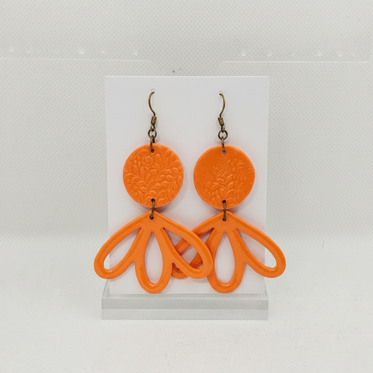 Large handmade orange polymer clay fan petal drop earrings with brass hook findings on plain white card, by Crafty Larder NZ