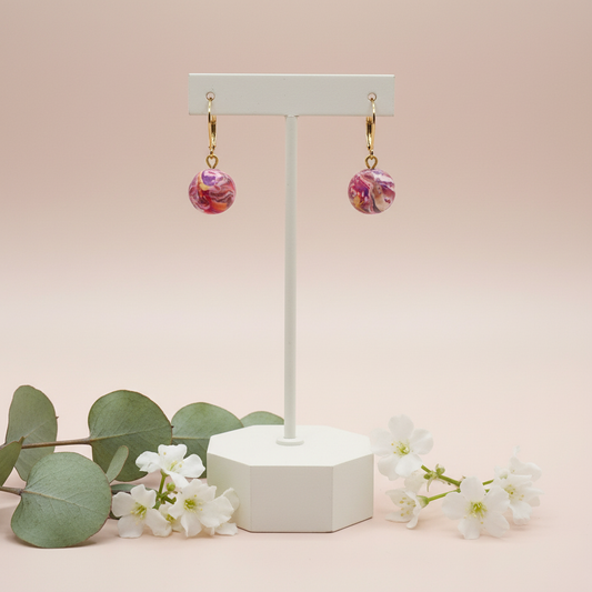 "Handmade polymer clay marble bead huggie earrings with pink coral purple round charms and gold hoops"