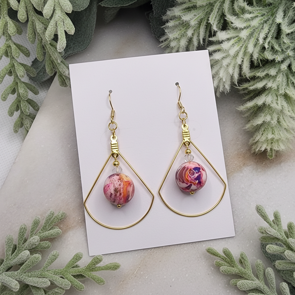 "Handmade polymer clay marble crystal duo dangle earrings with pink coral purple round beads inside gold teardrop frames and crystal accents"
