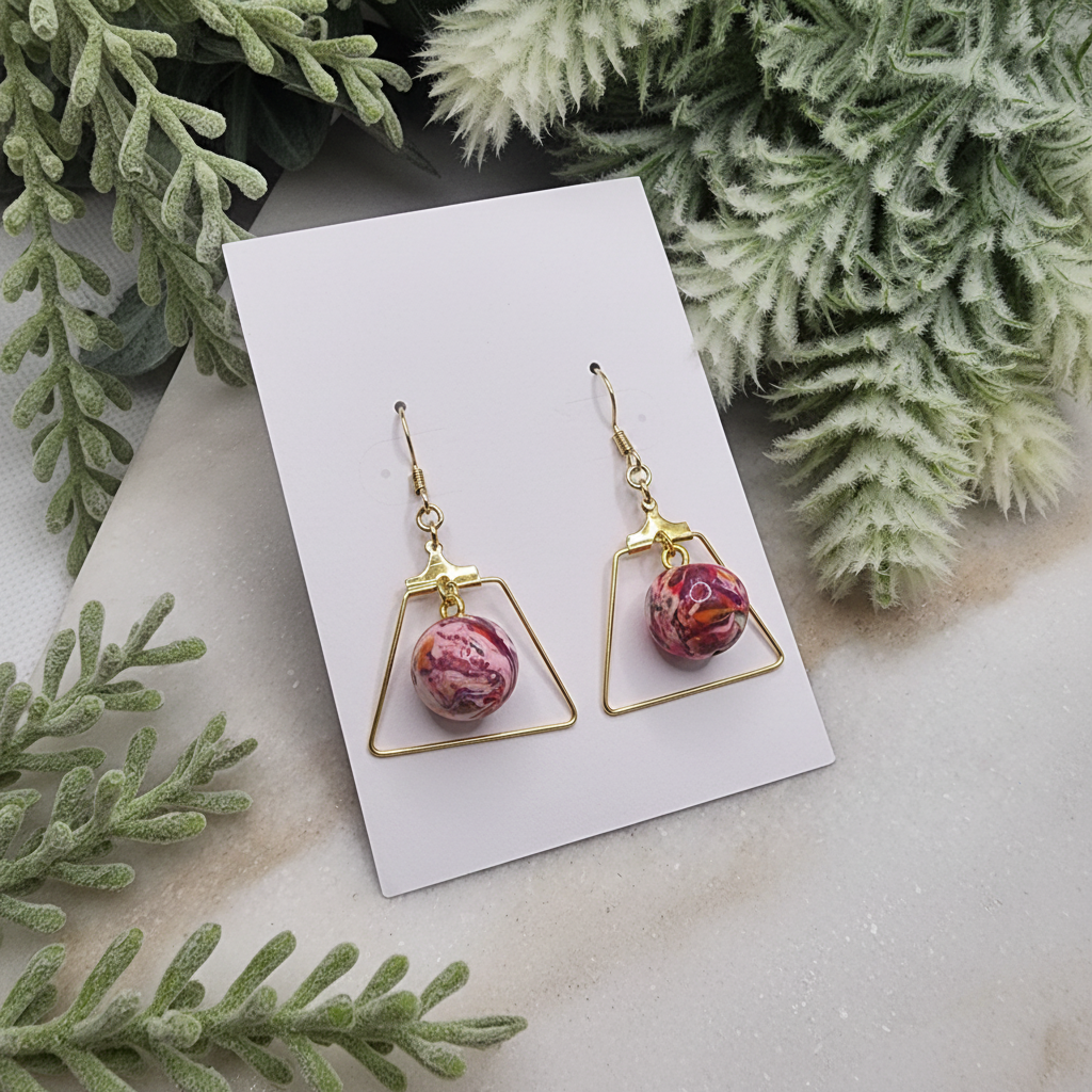  "Handmade polymer clay marble edge earrings with pink coral purple round beads inside gold triangle frames"