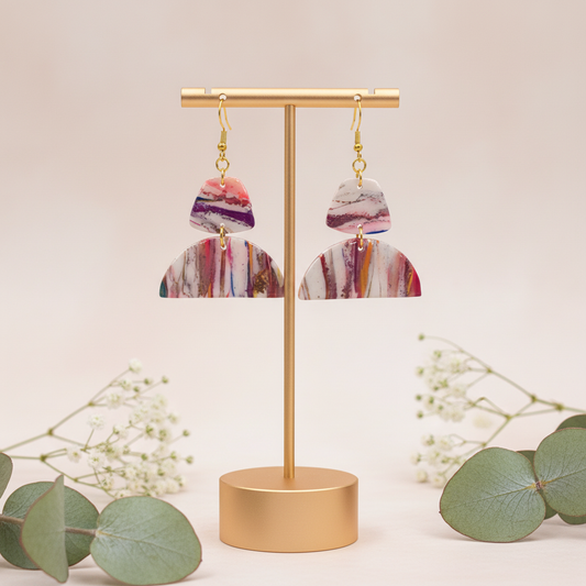 "Handmade polymer clay geometric marble earrings with pink purple coral striped pattern and gold connectors"