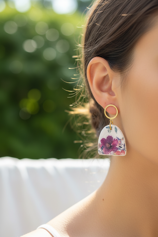 Woman wearing Garden Arch Dangles showing watercolour floral arch design with 18k gold-filled hollow circle studs