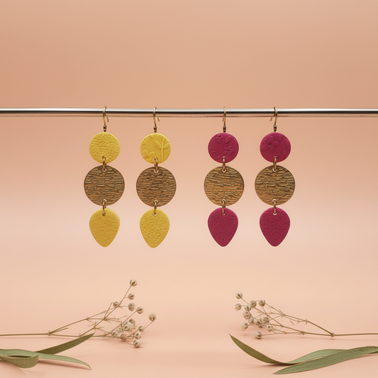 "Handmade polymer clay petite drop earrings with textured round stud, bronze oval, and teardrop - available in yellow and pink"