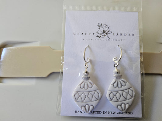 White and silver ornament earrings