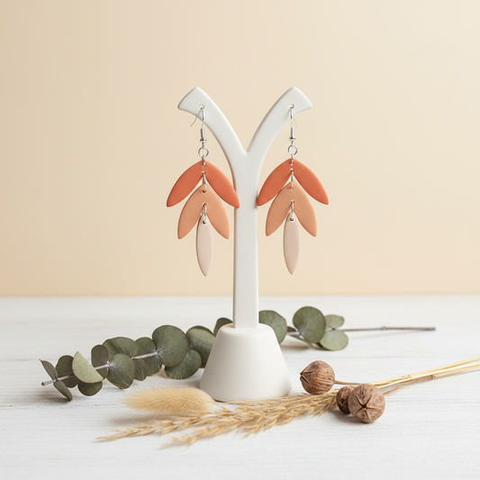 "Handmade polymer clay tri colour statement earrings with layered leaves in coral, peach, and cream gradient"
