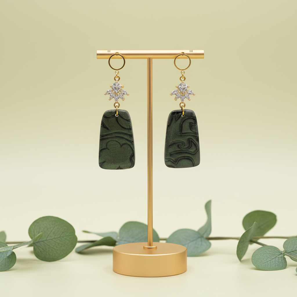 "Handmade polymer clay fob drop earrings with gold hollow circle stud posts, sparkling cubic zirconia snowflake connectors and dark green/emerald mica shimmer rectangular dangles"