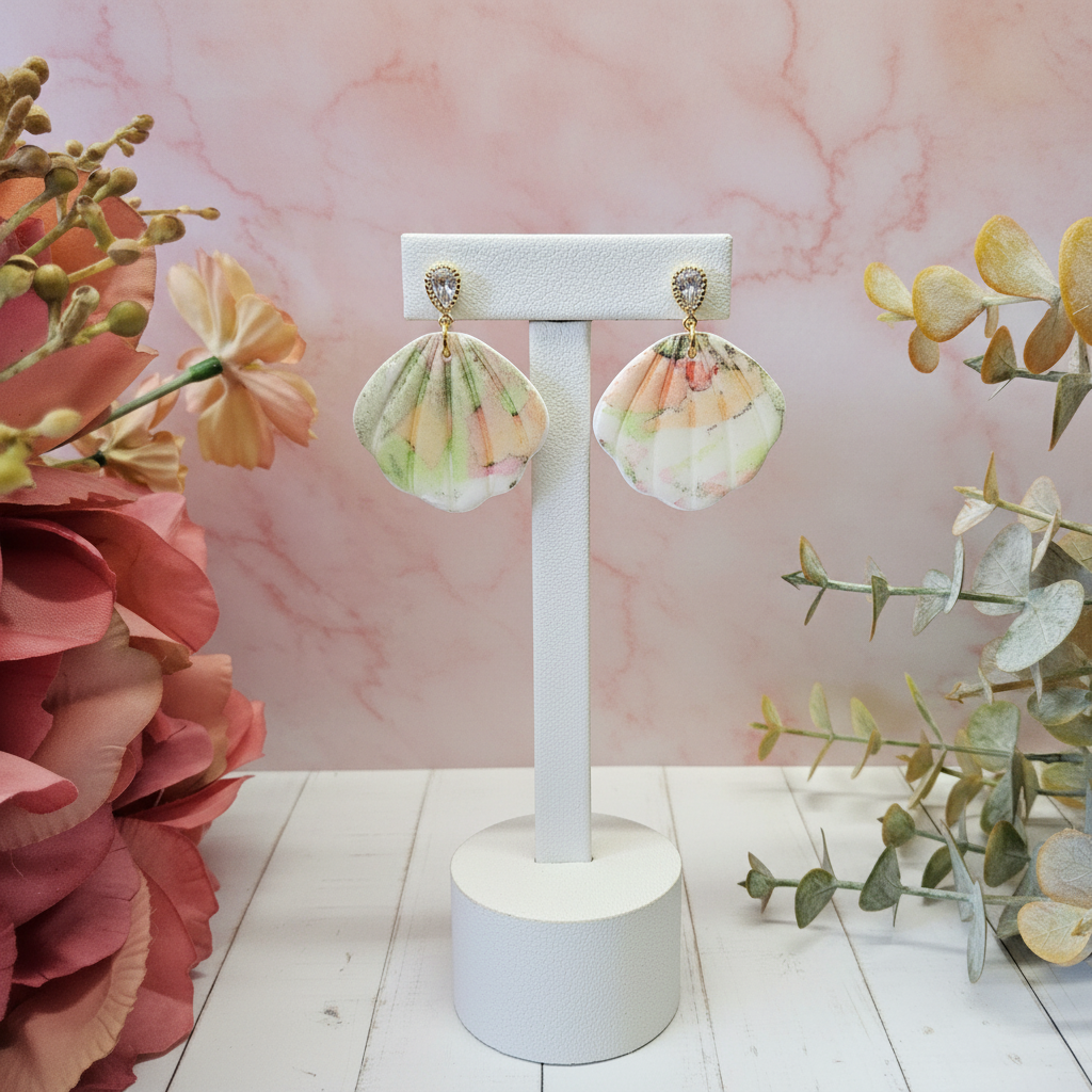 "Handmade polymer clay watercolour floral shell dangle earrings with sparkling cubic zirconia studs in soft pastel pink, peach, yellow and green tones"