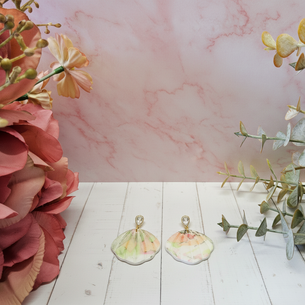 "Handmade polymer clay watercolour floral shell dangle earrings with sparkling cubic zirconia studs in soft pastel pink, peach, yellow and green tones"